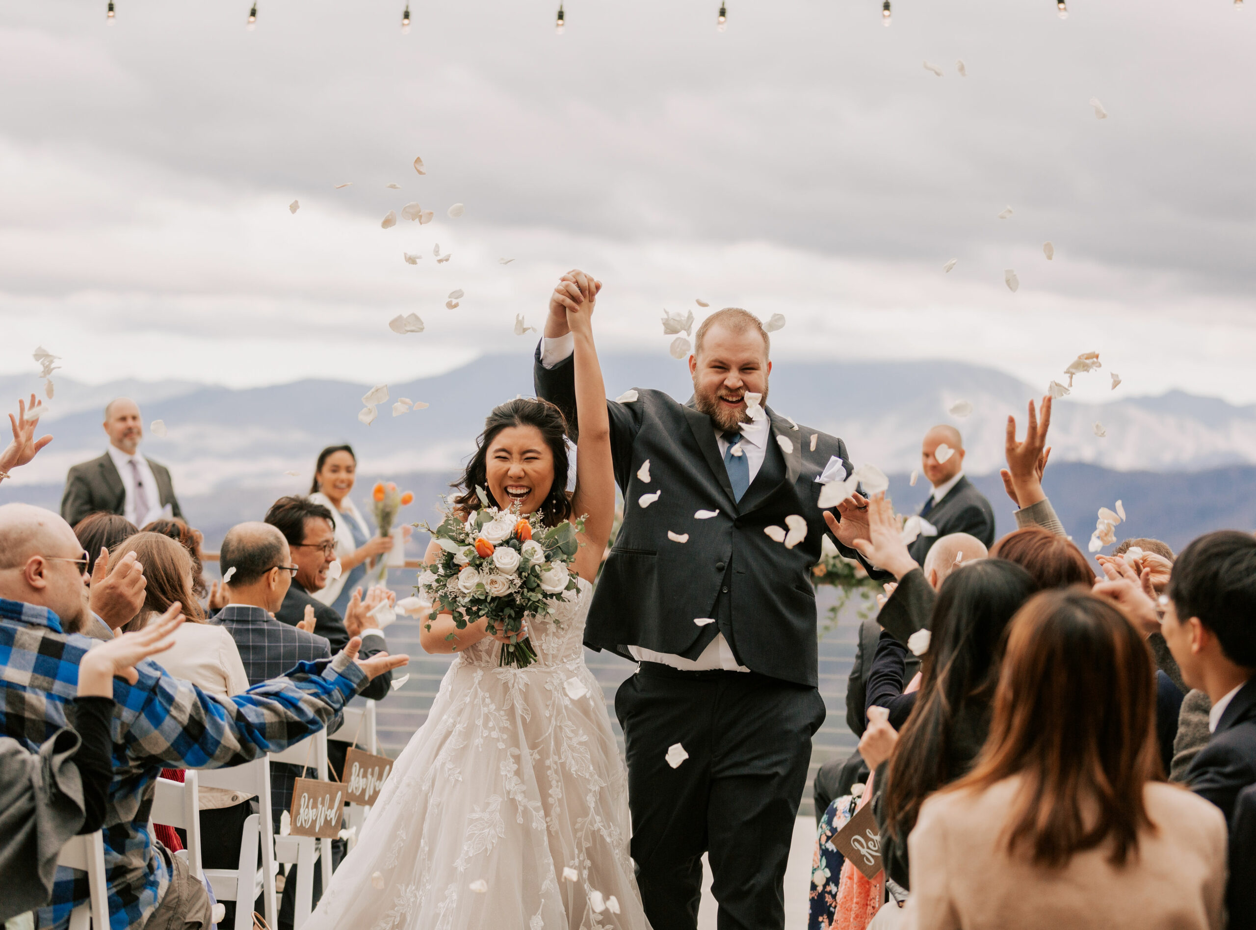flower petal toss with bride and groom