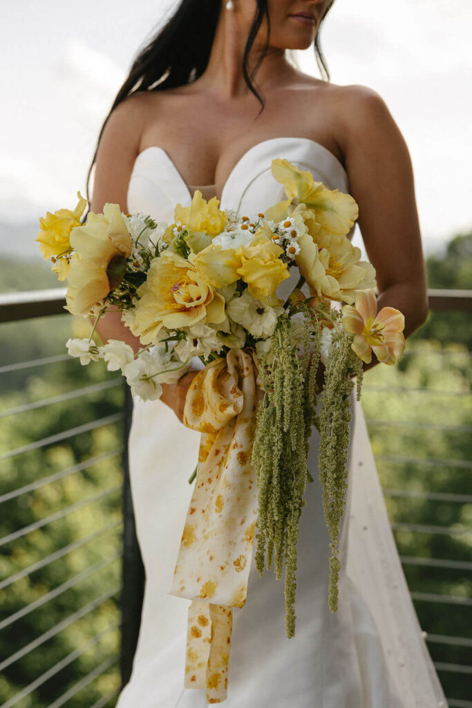 Floral bouquet with yellow accents perfect for a destination wedding bride.