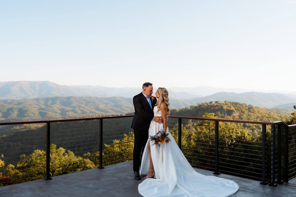 Wedding couple framed by rolling mountain views at a Tennessee destination wedding venue