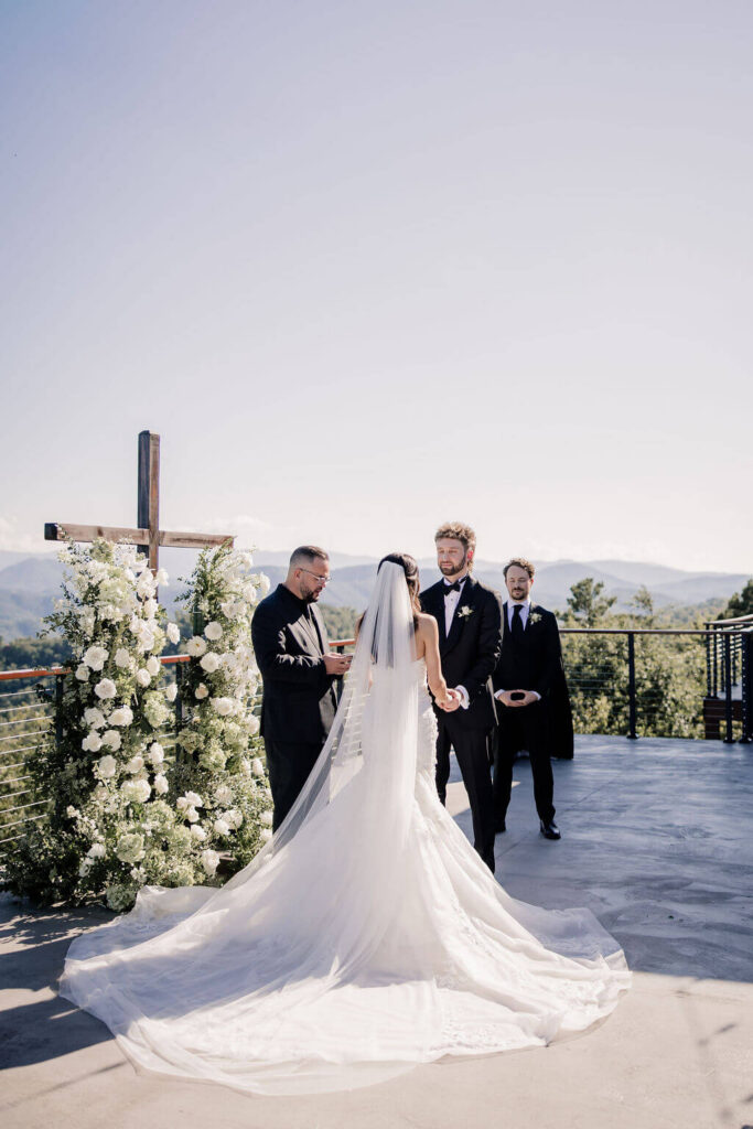 Black and White destination wedding, cross arbor, wedding ceremony in the mountains, white wedding florals 