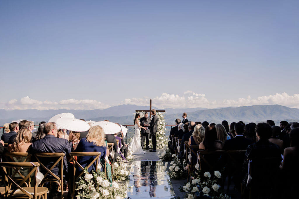 Black and White destination wedding, cross arbor, wedding ceremony in the mountains, white wedding florals 