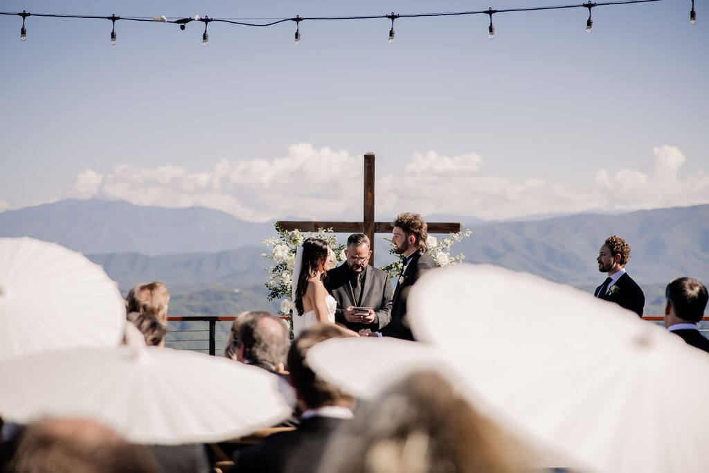Black and White destination wedding, cross arbor, wedding ceremony in the mountains, white wedding florals 