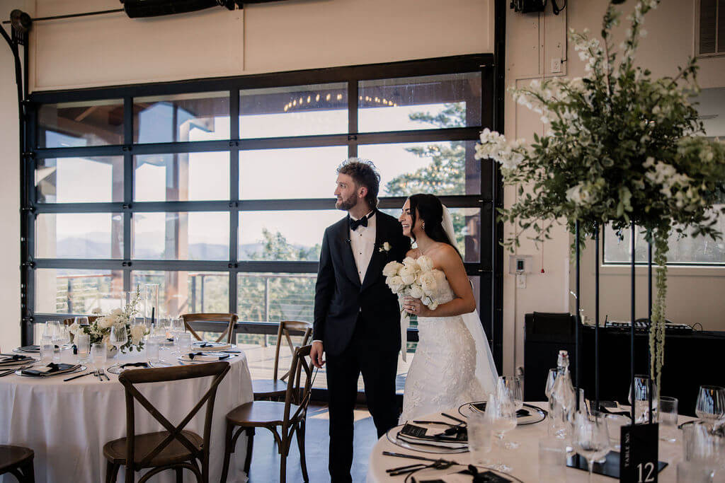 Black and White destination wedding, cross arbor, wedding reception at The Trillium Venue in East Tennessee, white wedding florals, black and white table decor